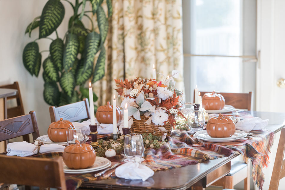 Thanksgiving table setting with pumpkin bowls