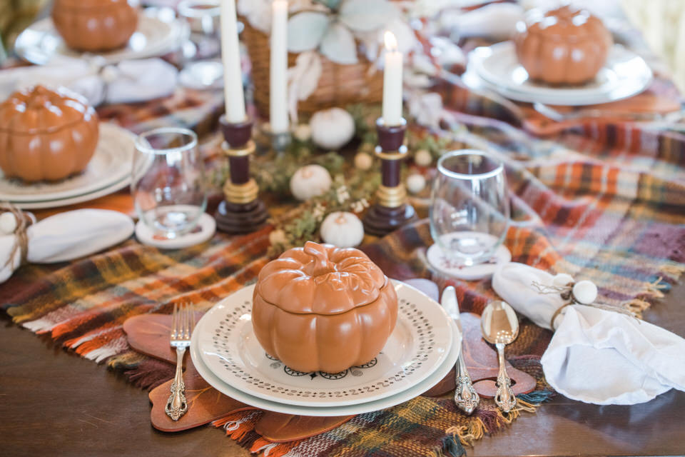 Thanksgiving table setting with pumpkin bowls