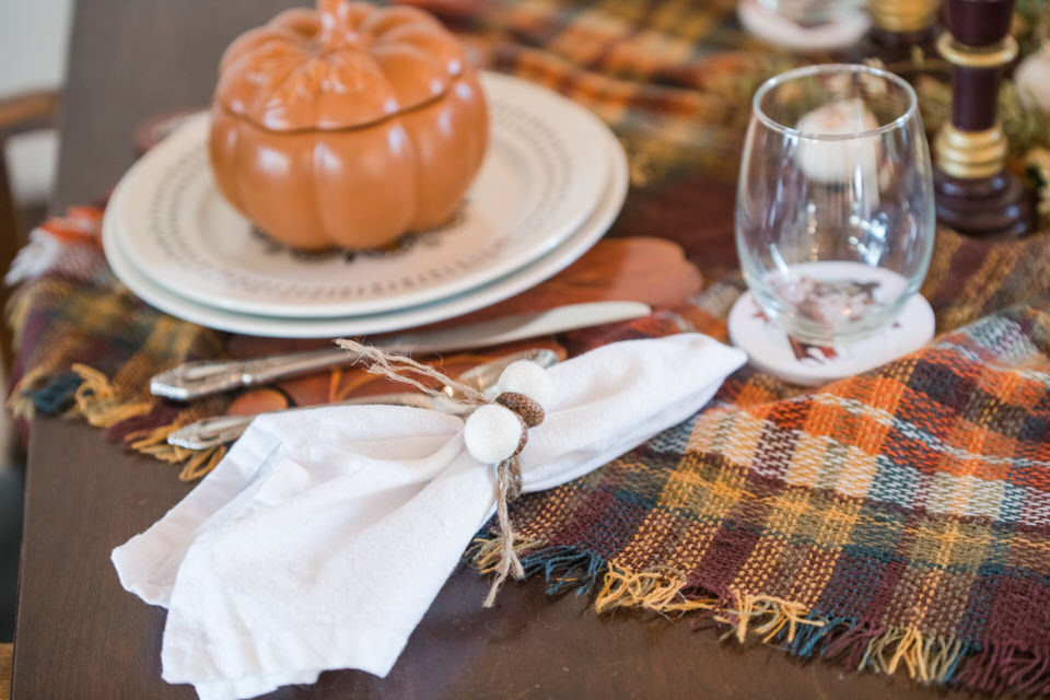 Thanksgiving table setting with Napkins tied with acorns