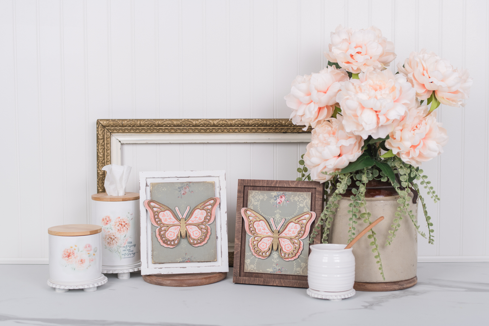 Close-up of a chalk couture butterfly silk screen transfer applied on a wood insert with an IOD paint inlay background in a changeable DIY frame.