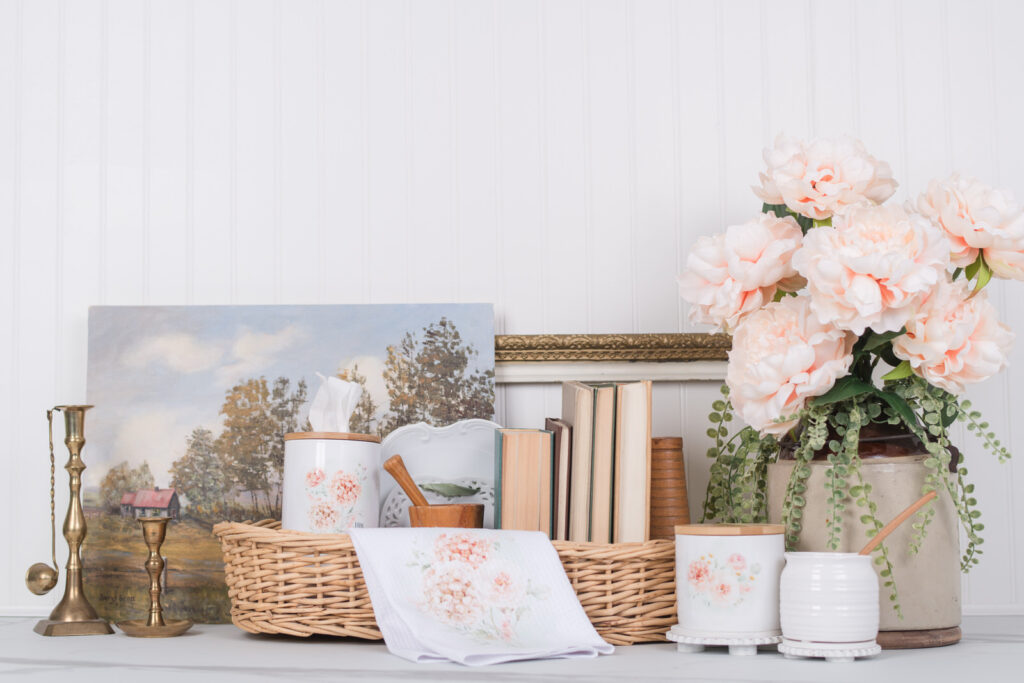 Cottagecore styled kitchen cupboard with floral tea towel and scripture verses on tissue box.