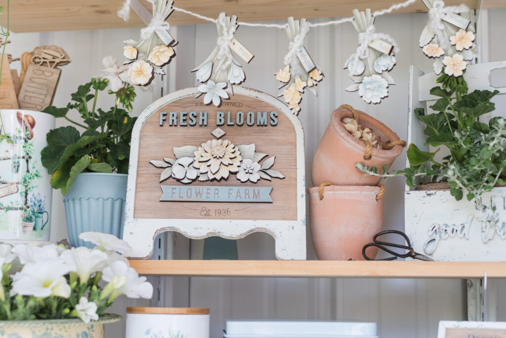 Soft, blues, yellows and white summer decor in a she shed 