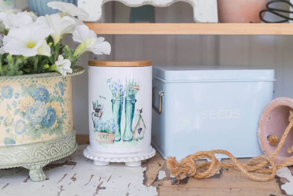 Country garden canisters served a great purpose on a potting table 