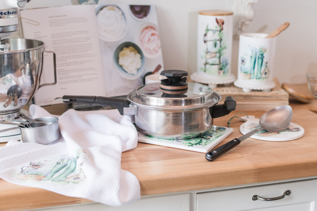 Hot pot from the stove top sitting on a trivet to protect you're butcher block from the heat paired with other kitchen essentials 
