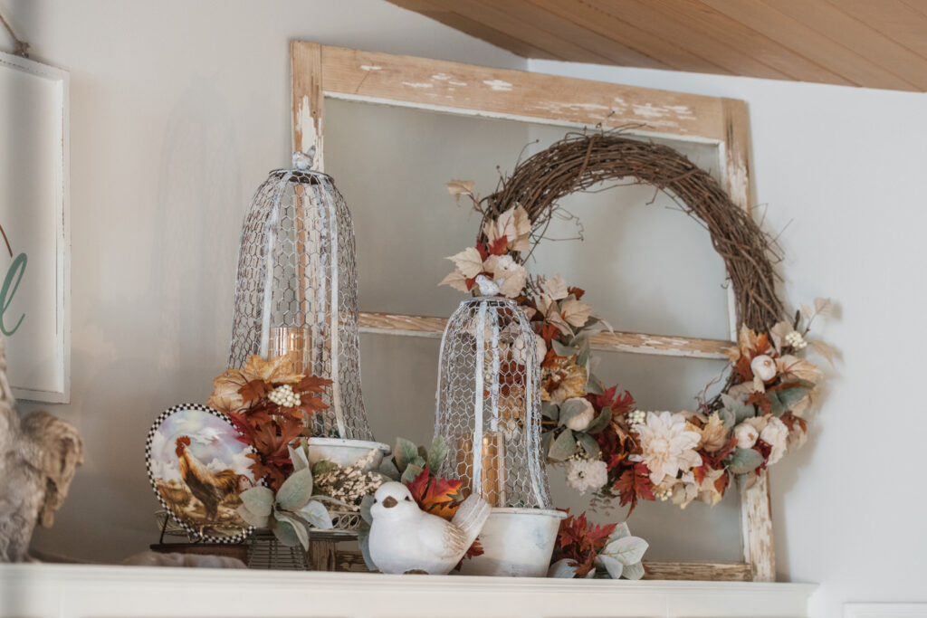 Vintage looking wired closures in front of our old farmhouse window with a great find wreath for fall 