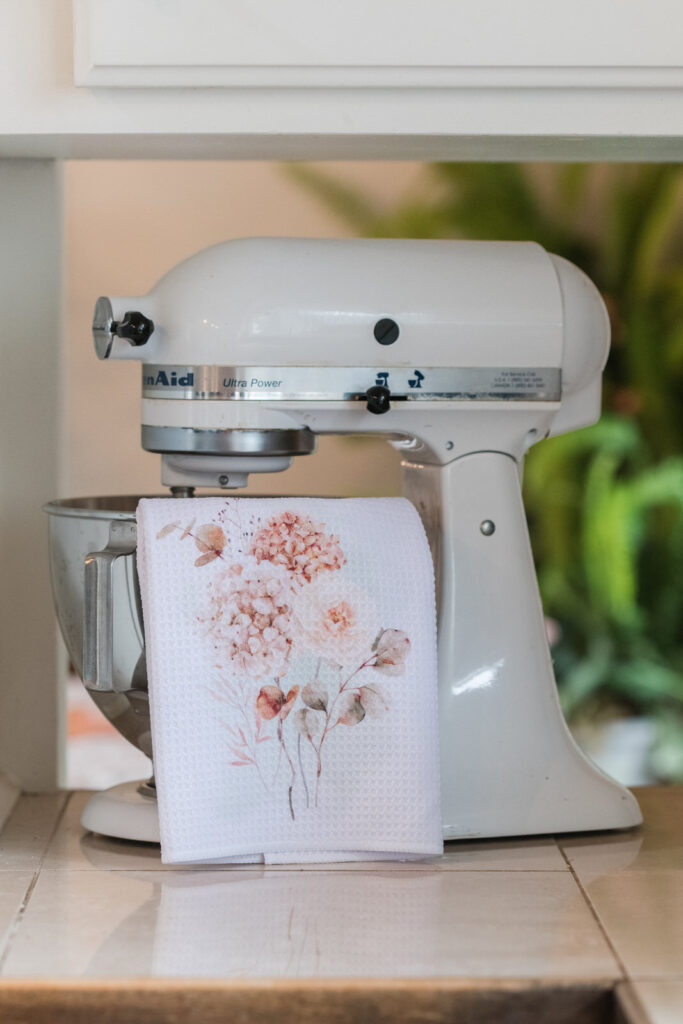 Spicy floral, autumn tea towel draped, over KitchenAid bowl 