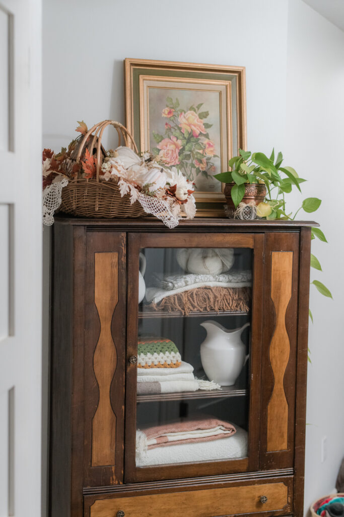 Fall linens lining, the shelves of an old China cabinet, turned linen closet 