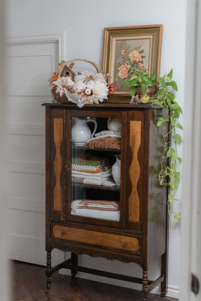 China cabinets re-purposed into a linen closet for the hallway decorated for fall 