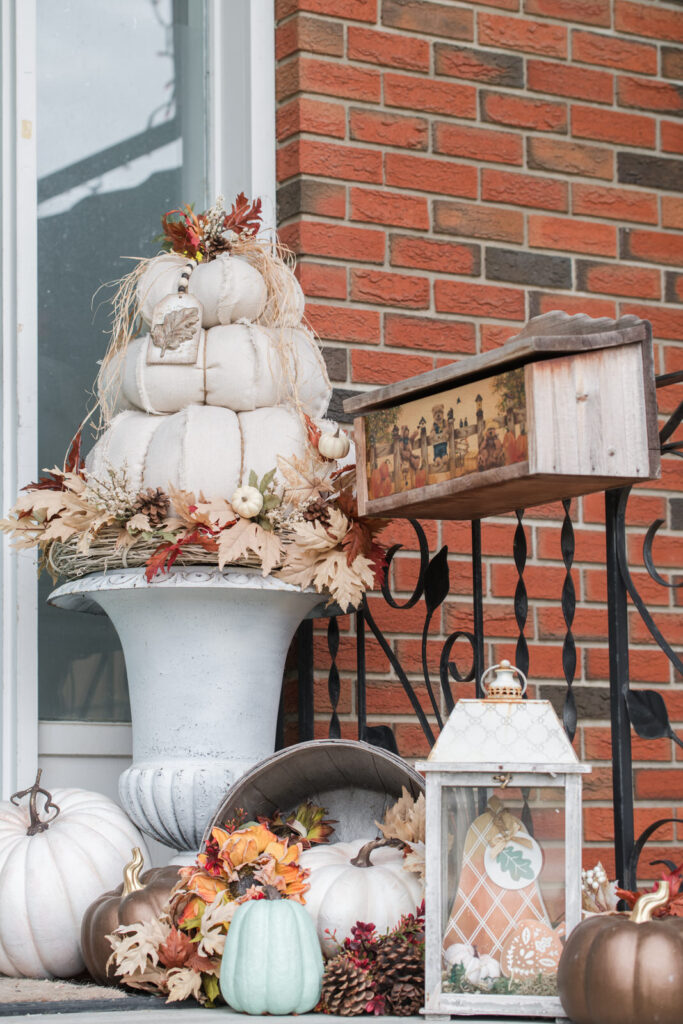 Entryway decorated with DIY drop cloth topiary pumpkins, styled with DIY acorn and leave tags from IOD moulds 