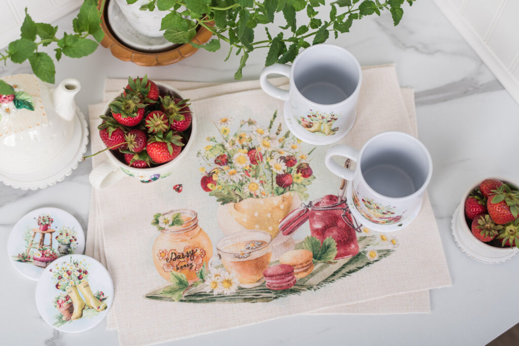Set of four strawberry placemats on a farmhouse summer counter or table