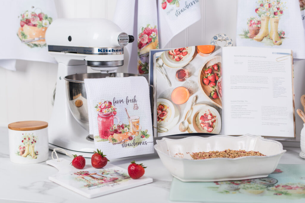 Strawberry draped over Kitchen Aid Mixer, styled with other strawberry decor in the kitchen