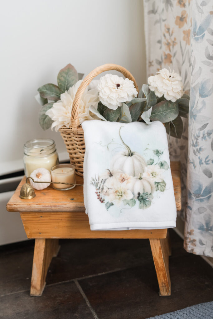 Farmhouse bathroom refresh with fall hand towel, candles, and thrifted basket