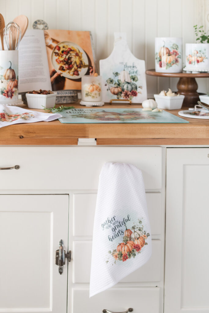 Tea towel hanging from drawer handle on repurposed Hoosier cabinet in farmhouse kitchen