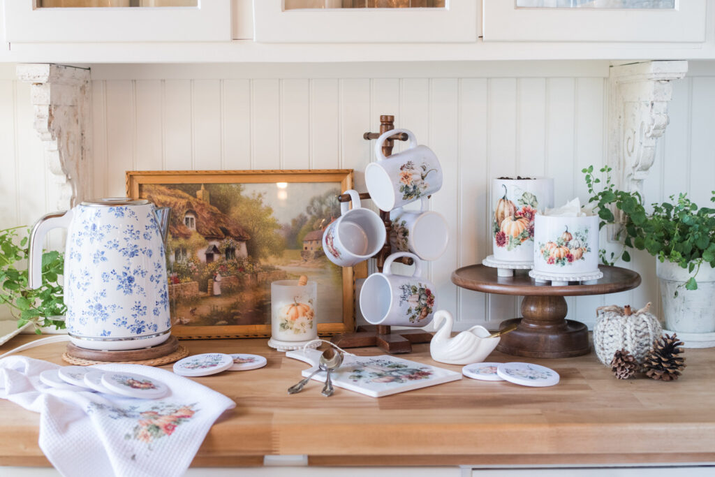 Autumn kitchen styling with scripture-inspired towels, mugs, and canisters.