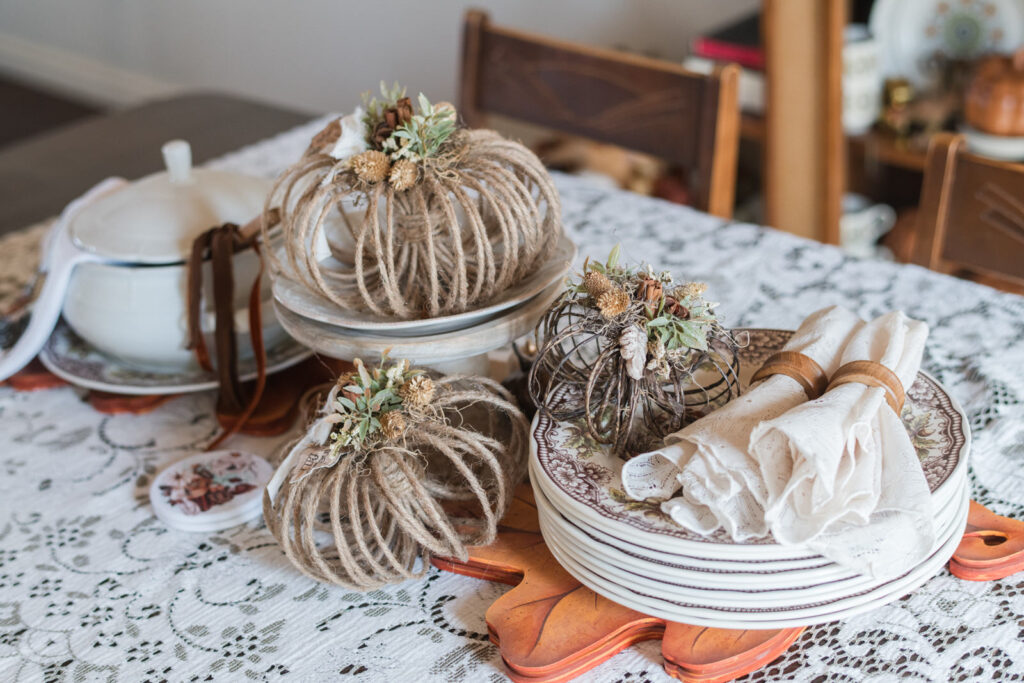 Jute pumpkin styled in a fall centerpiece on a thanksgiving table 