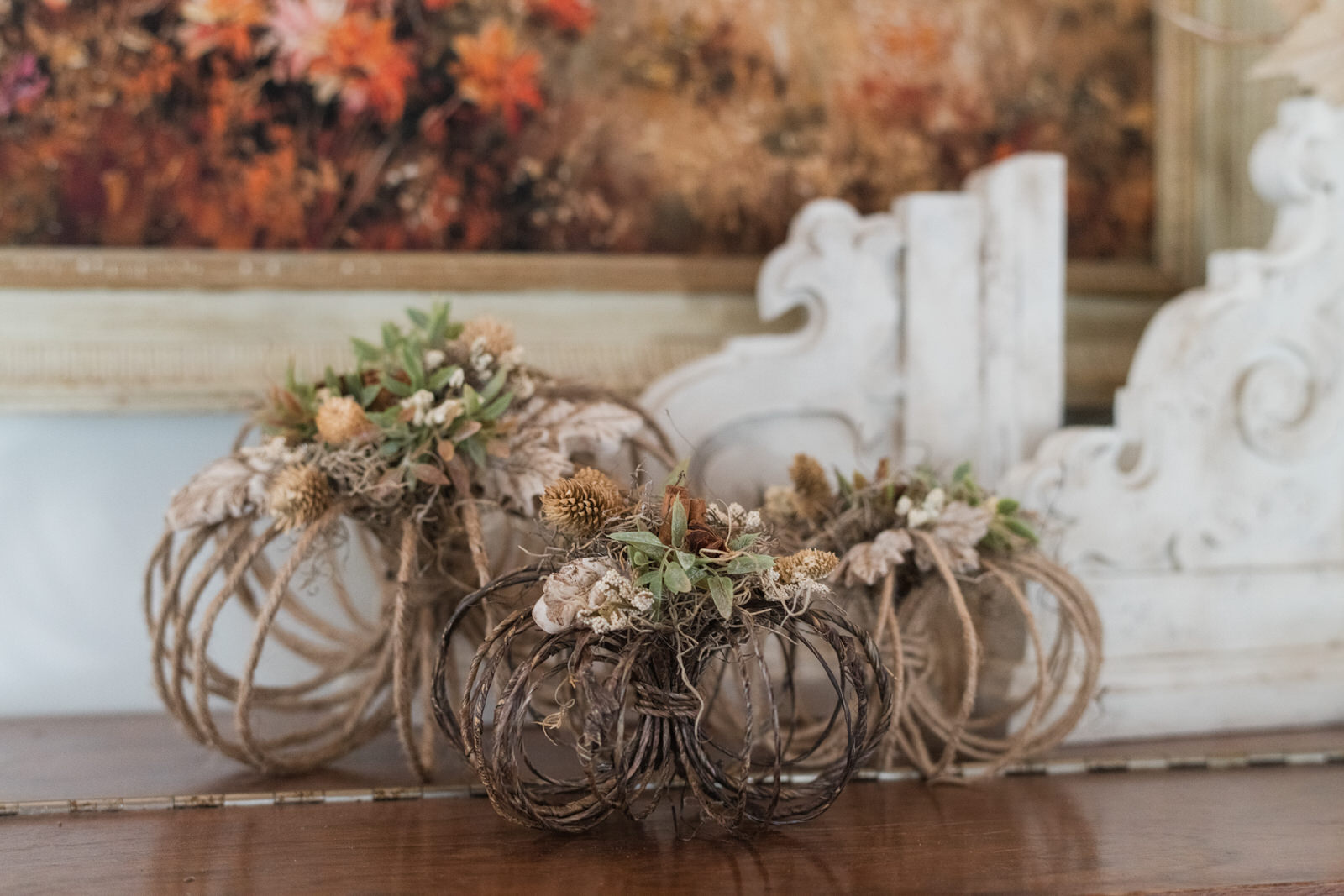 DIY Jute Pumpkins with IOD Moulds and Resin on a fall mantel