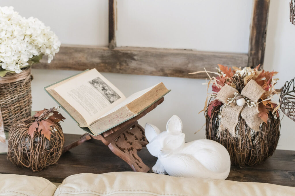 vintage book stand with antique book and cement fox