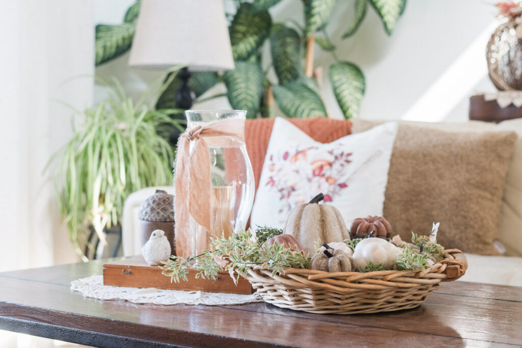 Cozy fall coffee table styled with painted pumpkins and gourds
