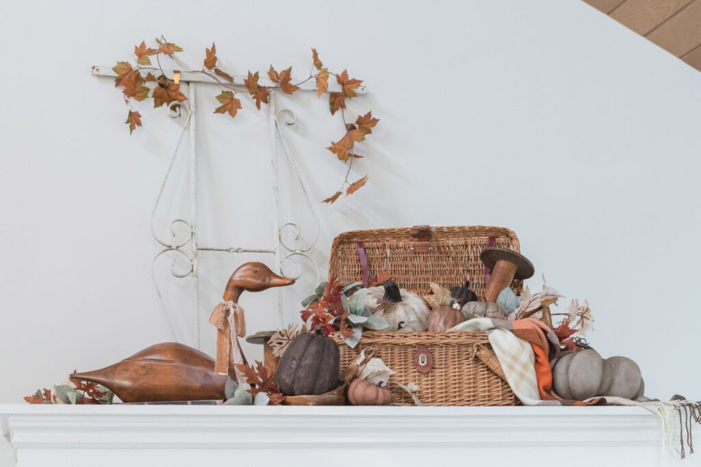 picnic basket full of painted pumpkins