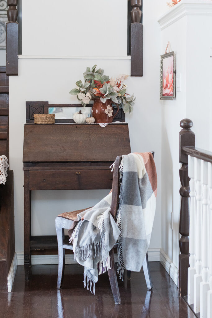 Family heirloom desk styled with fall accents in cozy farmhouse living room
