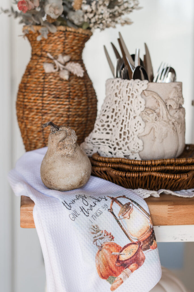 Thanksgiving buffet or fall serving cart styled with draped tea towel and autumn decor