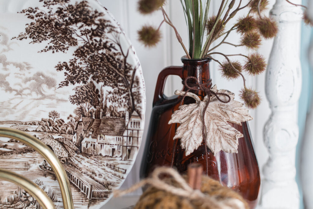 leaf accents tied around an amber bottle for cozy Thanksgiving decor