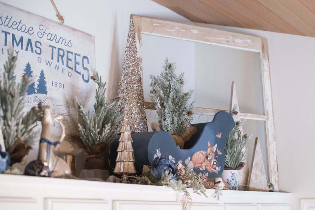 Painted sleigh and navy accents styled for an elegant farmhouse Christmas kitchen