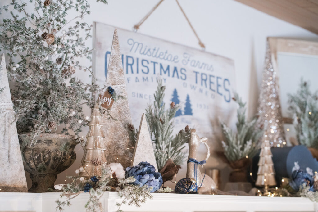 Elegant farmhouse kitchen decorated for Christmas with navy and white palette