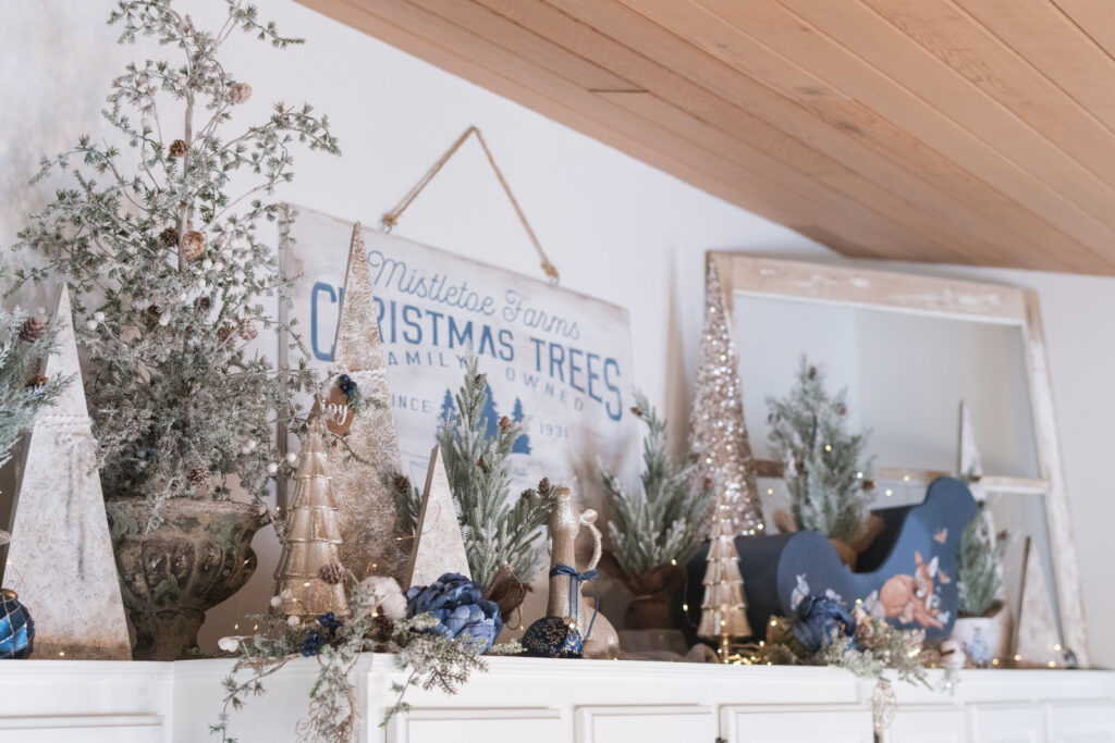 Blue, white, and gold farmhouse Christmas kitchen decor with tree theme