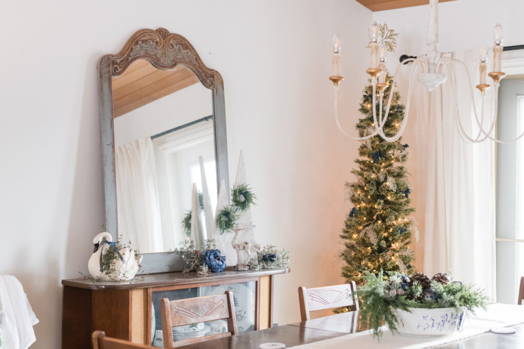 Elegant farmhouse Christmas dining room with blue and gold decor