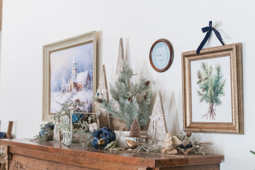 Elegant farmhouse wall art and greenery with gold and blue accents