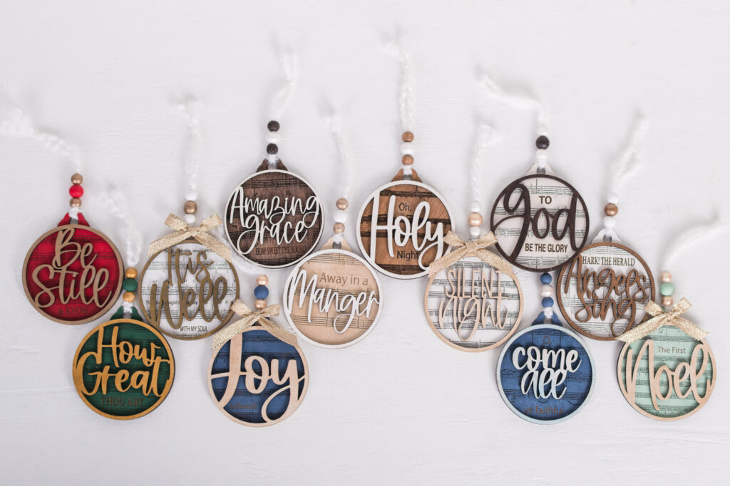  Full Ornament Collection** Alt text: “Complete set of handmade hymn ornaments in rich Christmas colors, including ‘Be Still,’ ‘How Great Thou Art,’ ‘Joy to the World,’ ‘Away in a Manger,’ and more.” 