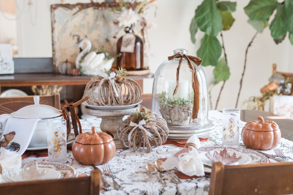 Fall dining room table with centrepiece and placesettings with heirloom in DIY pieces