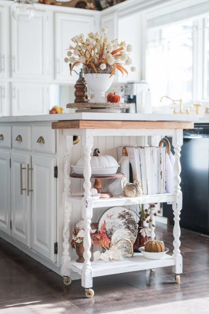 Finished cottage-style kitchen cart beside painted island and new countertops — sneak peek of kitchen makeover.