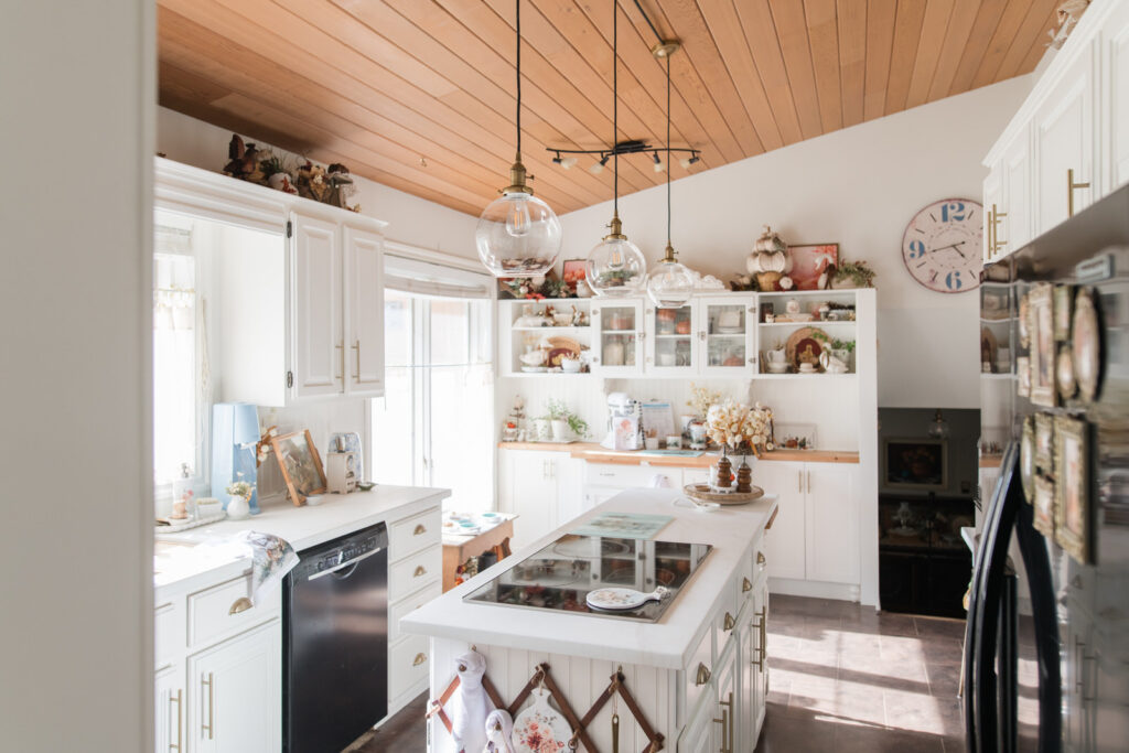 white kitchen in a cottage style decorated for fall