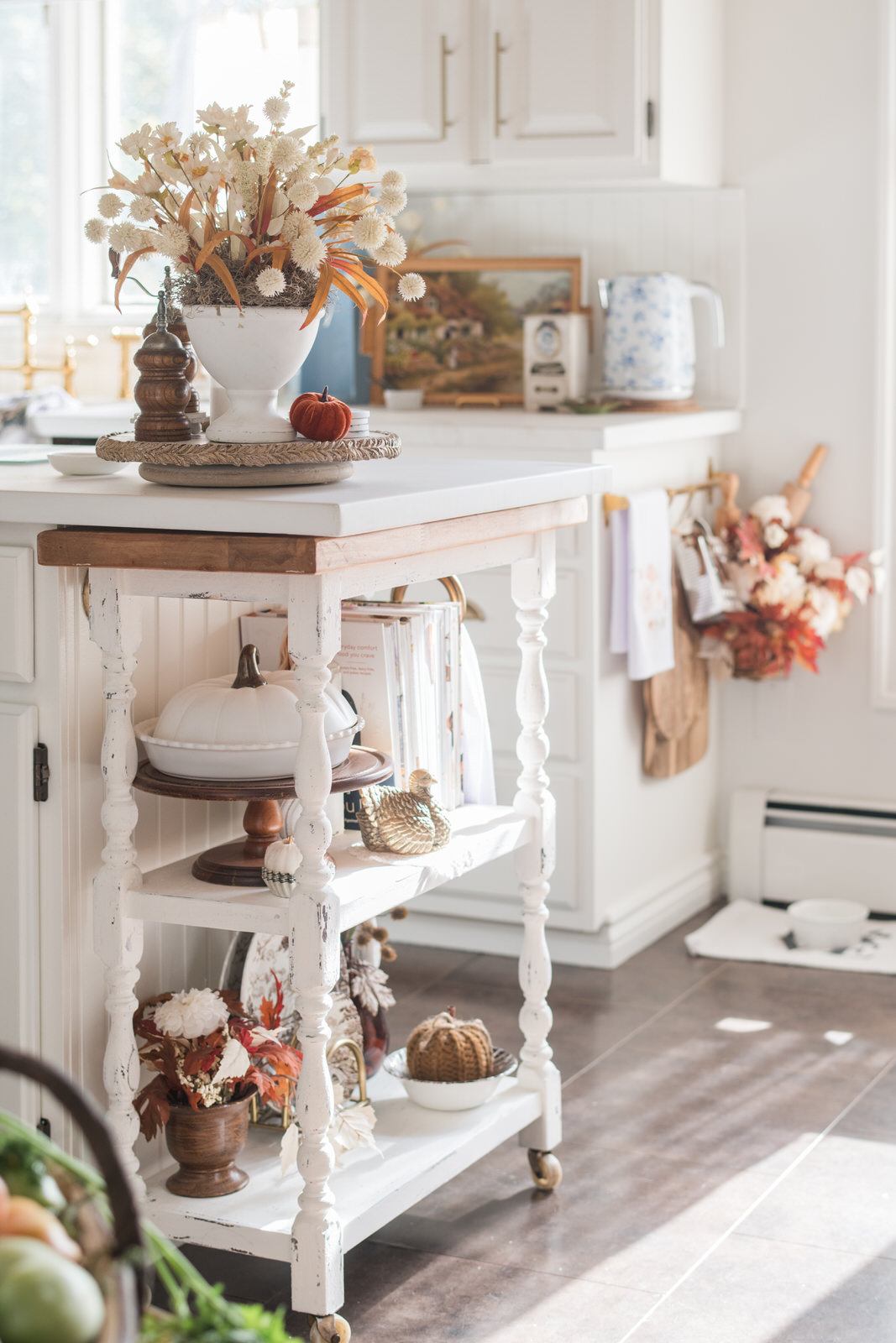 Finished cottage-style kitchen cart beside painted island and new countertops — sneak peek of kitchen makeover.