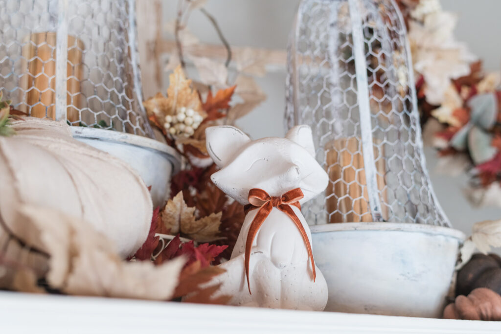  Cement fox with a velvet, terra-cotta coloured bowtie in fall kitchen decor 