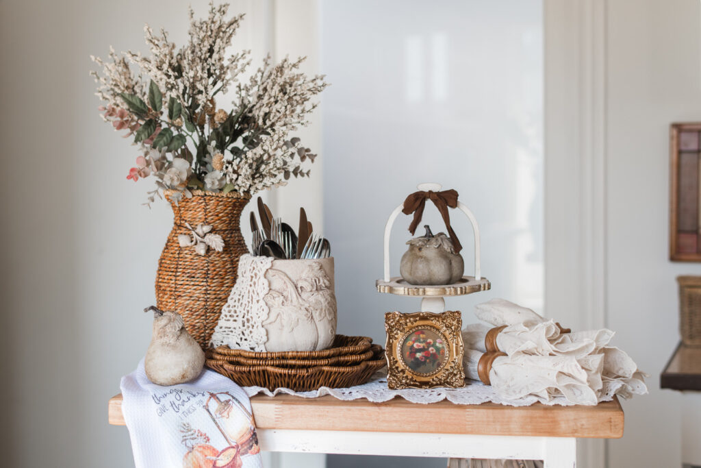 Timeworn ceramic pot with Hello Pumpkin mould used as Thanksgiving cutlery holder