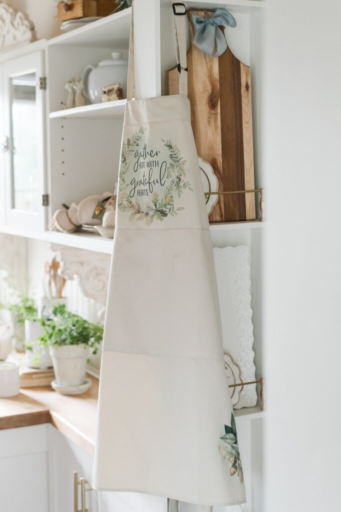  gather here with grateful hearts, kitchen apron, hanging by a baking station