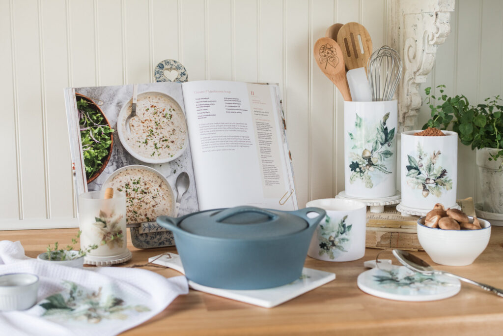 Woodland canisters in a baking area with a trivet for a hot casserole dish, and a cookbook in the background.