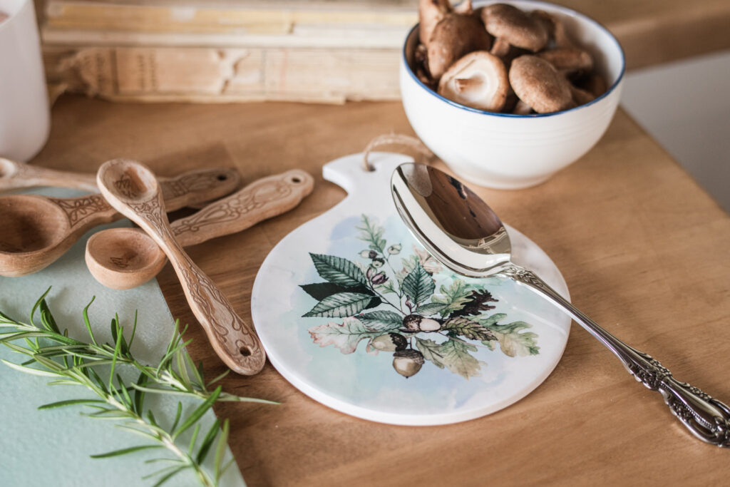 Round ceramic fall, spoon rest on a butcher block