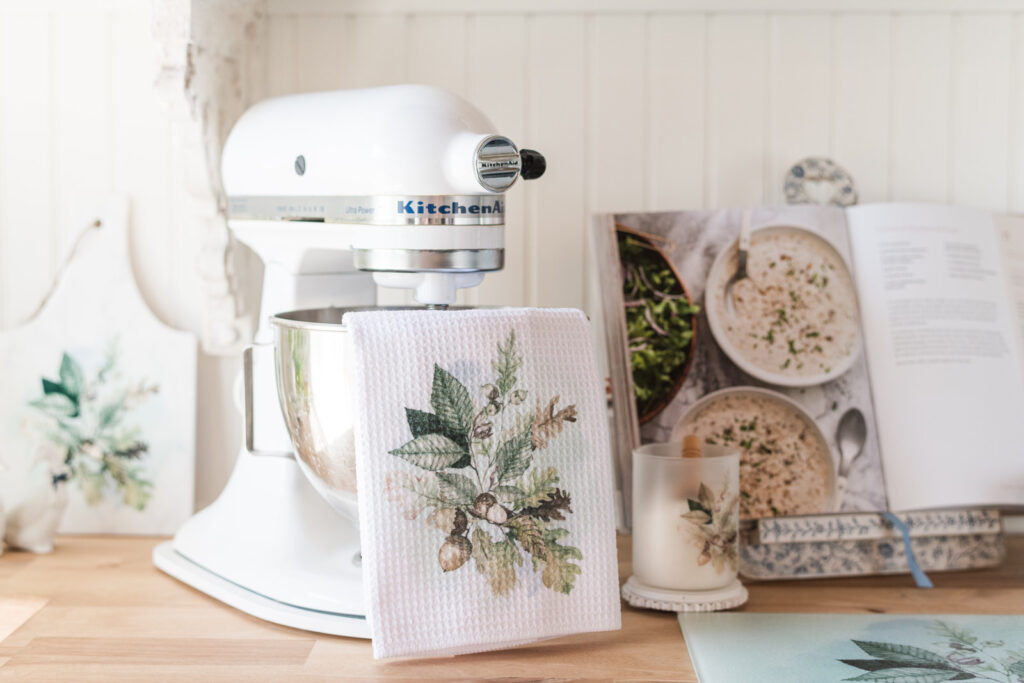 Kitchen towel draped over a KitchenAid stand in a baking area