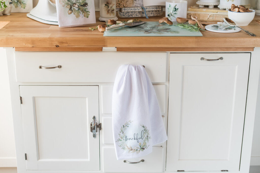 Tea, towel hanging over drawer handle of a baking cabinet in the kitchen 