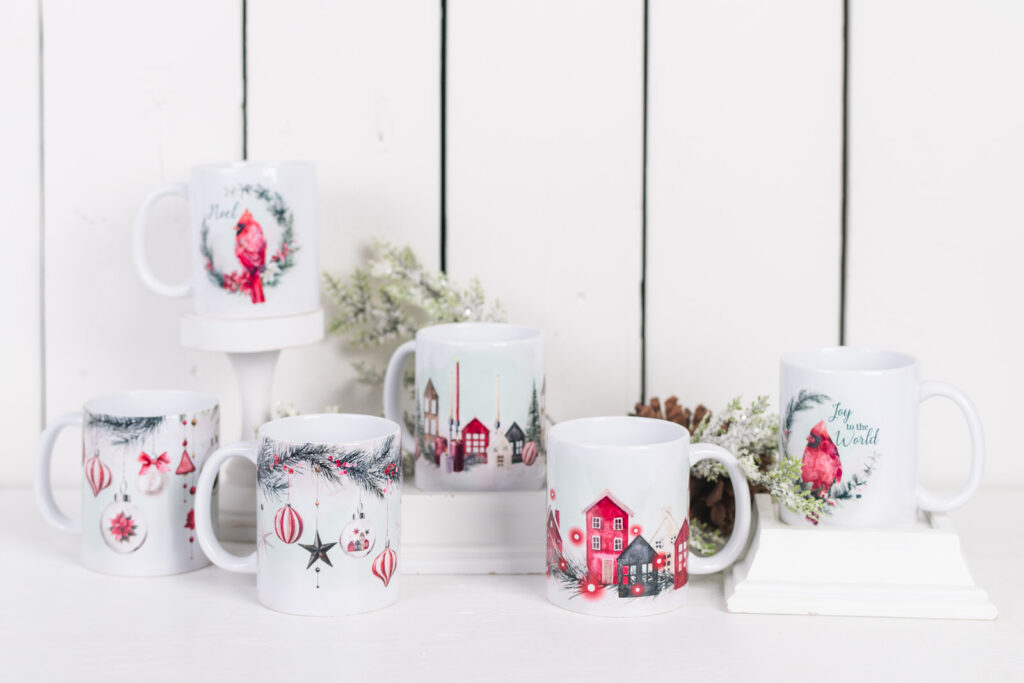 Faith-inspired Christmas mugs with cardinal and hymn title