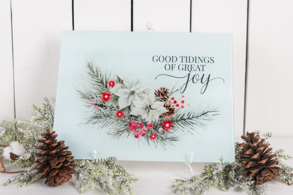 Good Tidings Of Great Joy Cutting Board with red poinsettias