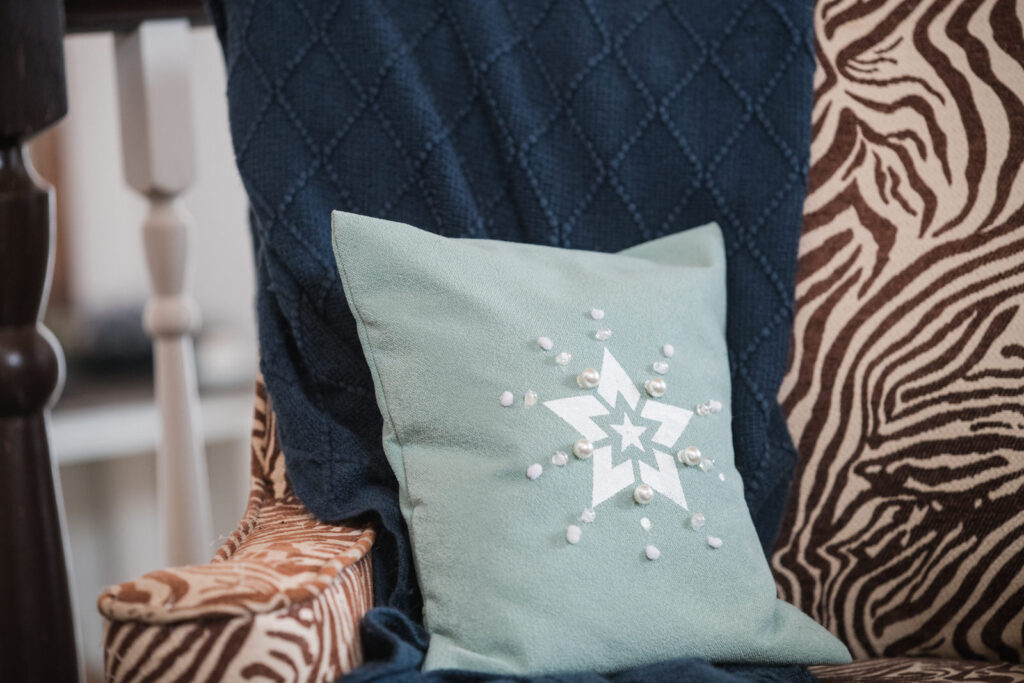 Small chair pillow with a silk screen star stencil with glued on pearls