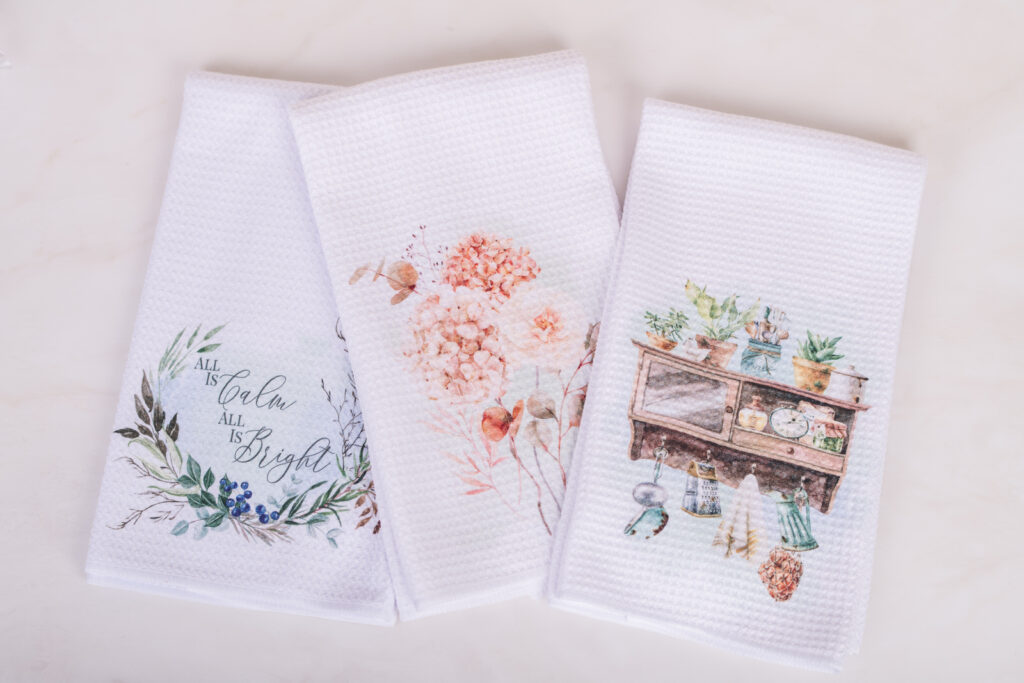 three seasonal tea towels ready for gifting