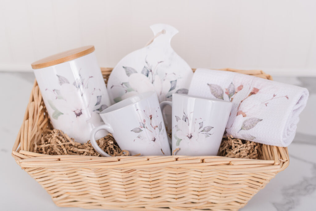 Magnolia coffee gift set. With a magnolia coffee canister, trivet, two latte, mugs and magnolia kitchen towel.