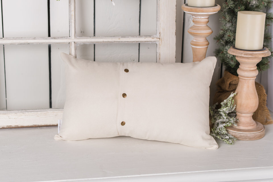 Snap closure back of a pillow cover on a lumbar style pillow