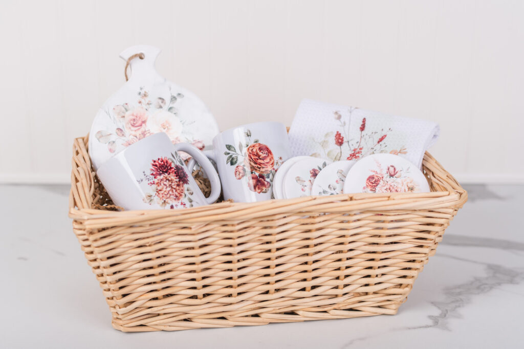 Cozy Coffee Gift Set in Spicy Floral with mugs, trivet, coasters, and tea towels in a basket